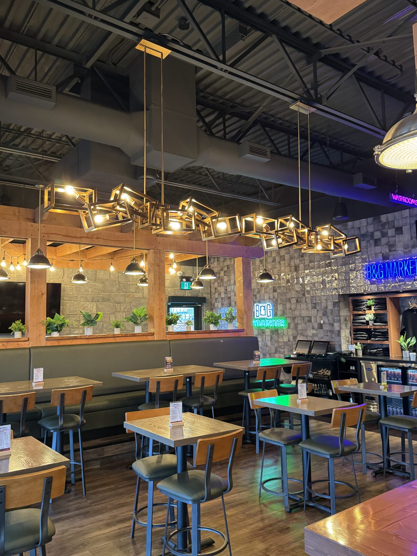 Restaurant interior with stone walls, wood beams, and modern lighting — Blowers and Grafton (Lloydminster)