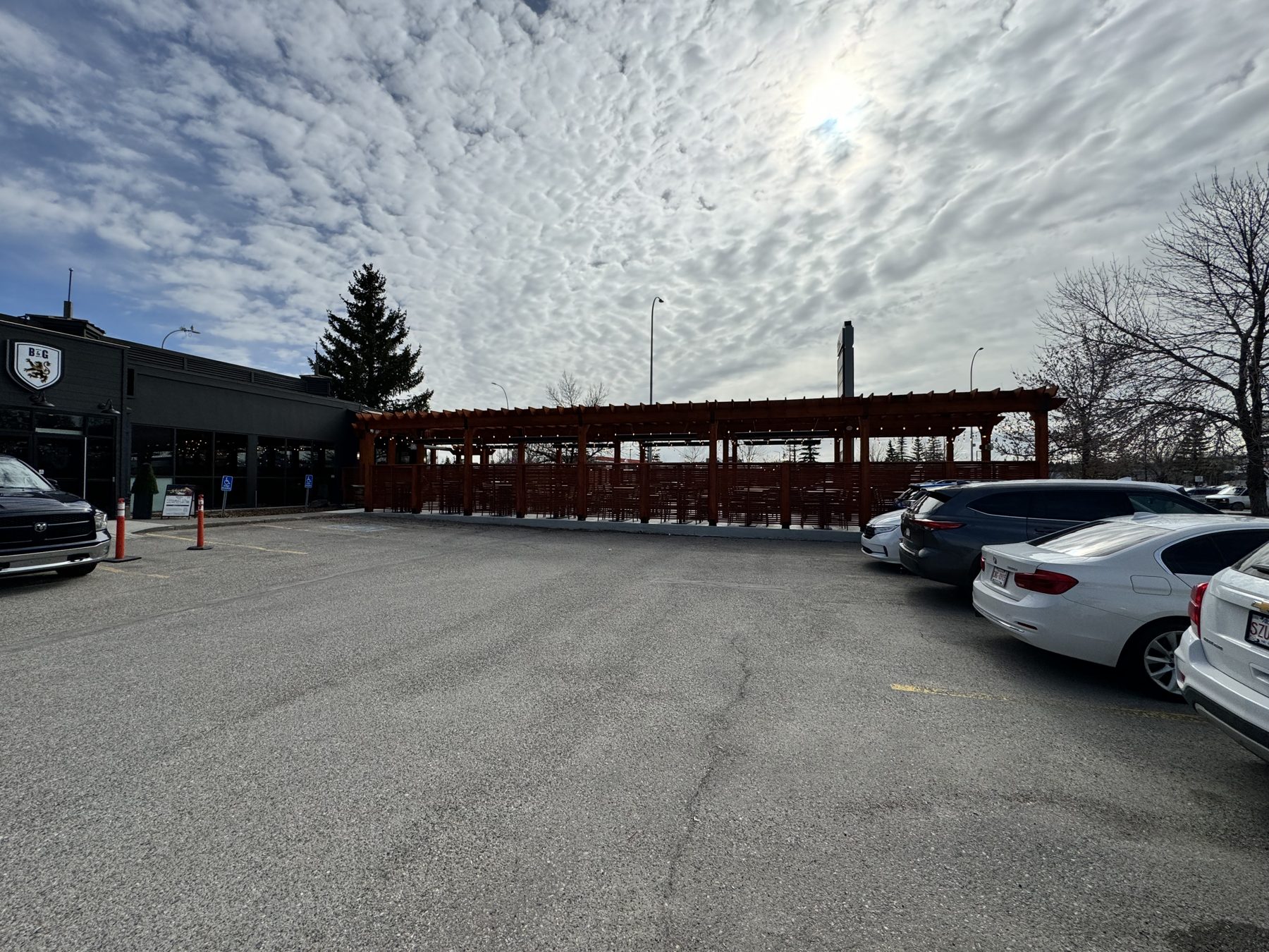 New outdoor patio structure with tables and chairs, unfinished — Blowers and Grafton (Medicine Hat)