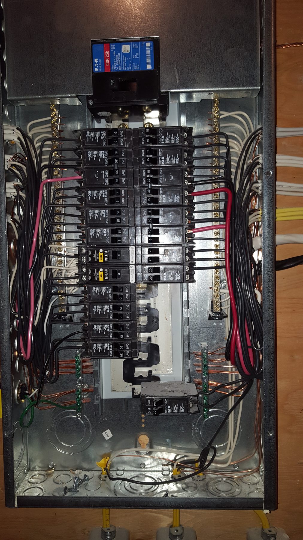 Electrical panel with breakers and wires in metal box — Milan House, West Hillhurst, Calgary (Deanmark)