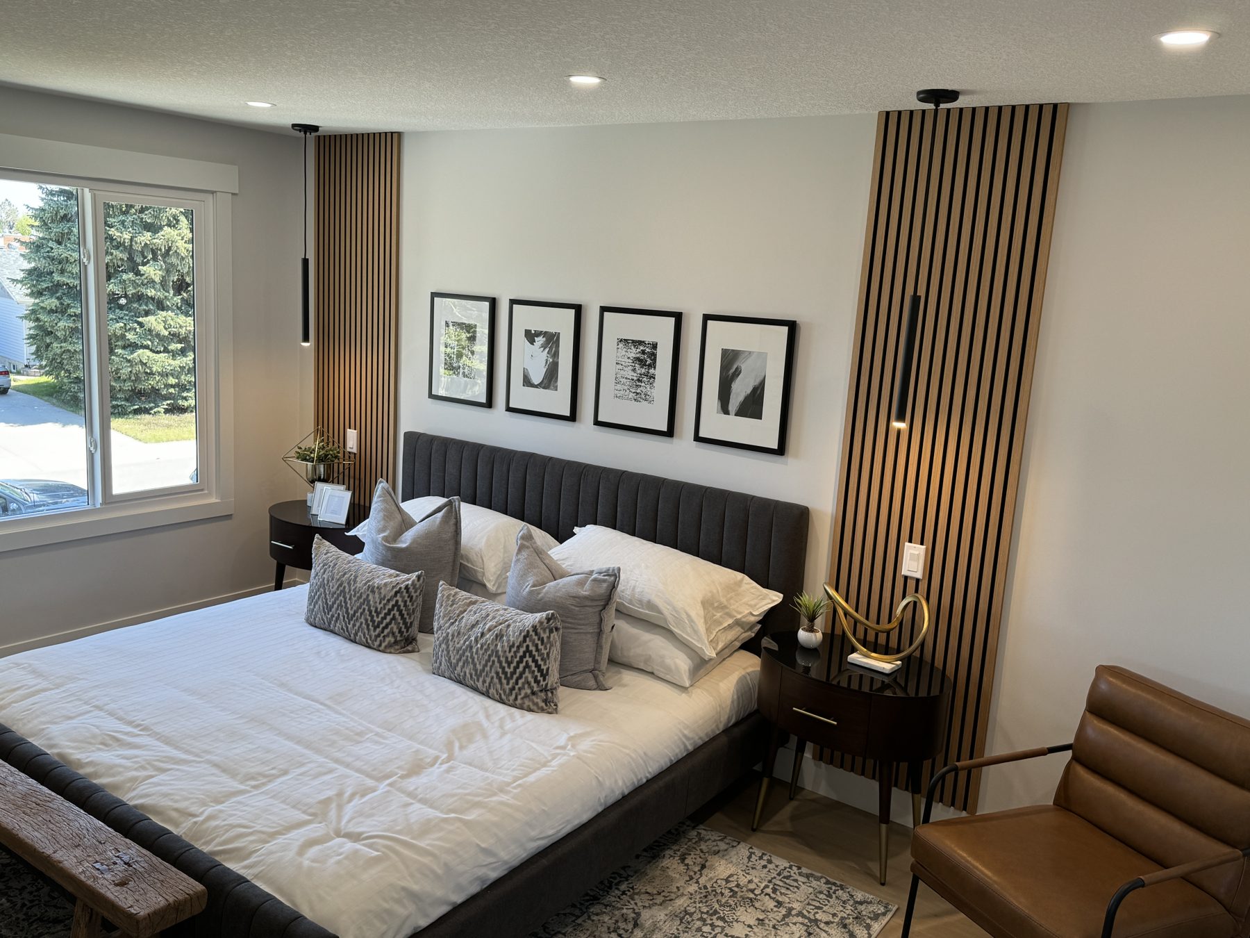 Bedroom renovation with wood slat walls and modern light fixtures — Lake Bonavista