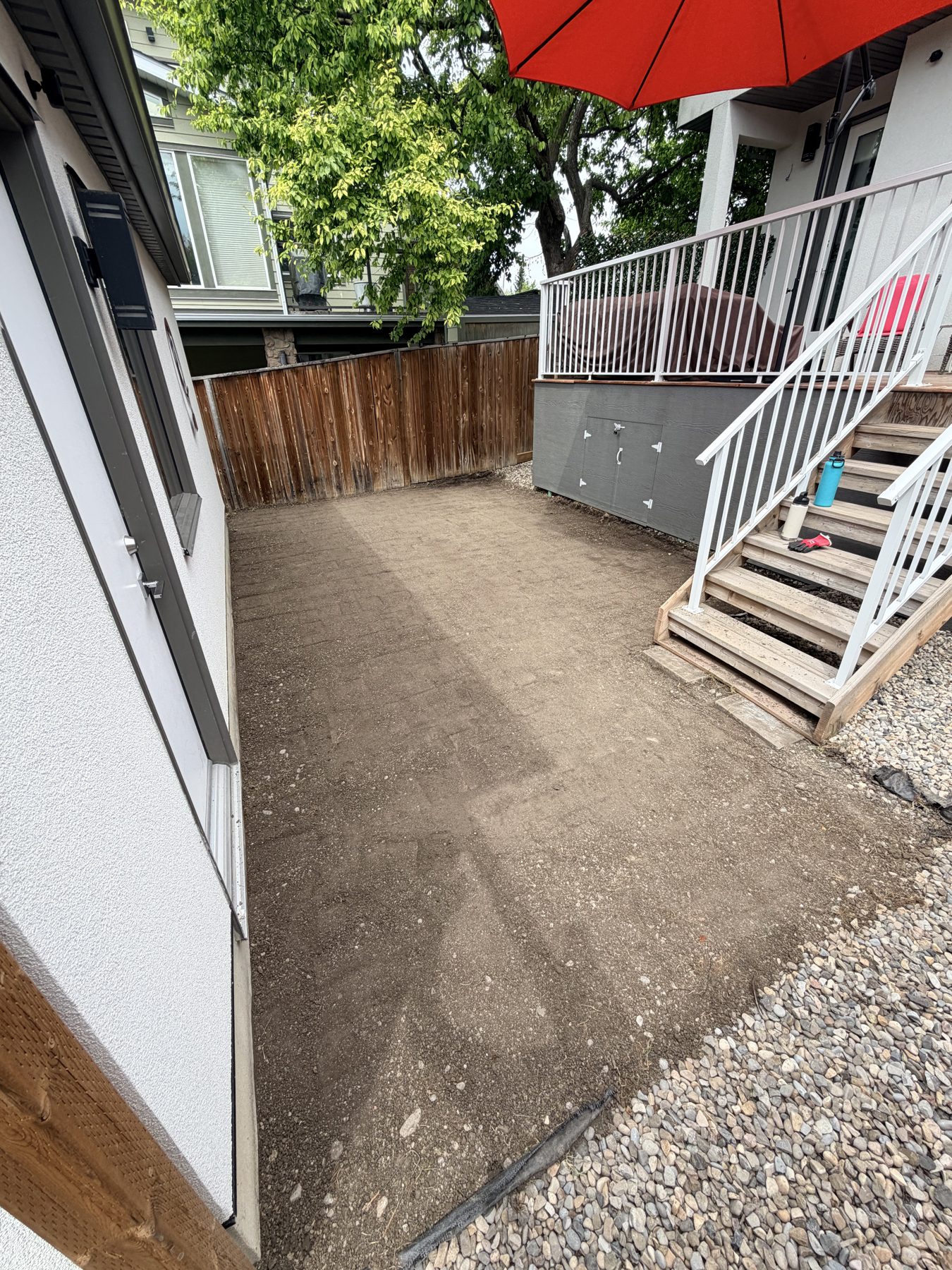 Backyard prepared with gravel and dirt for new patio installation — 3505 41 Street SW, Calgary by Onsite Contracting Services