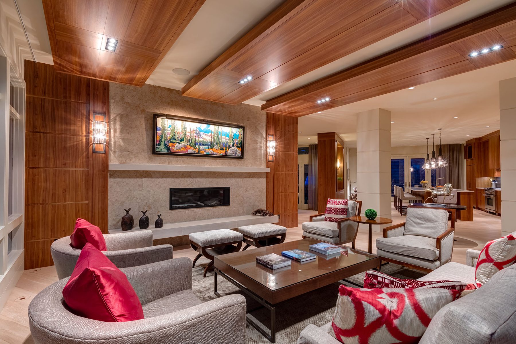 Modern living room with wood paneling, stone fireplace, and plush seating — Evolution