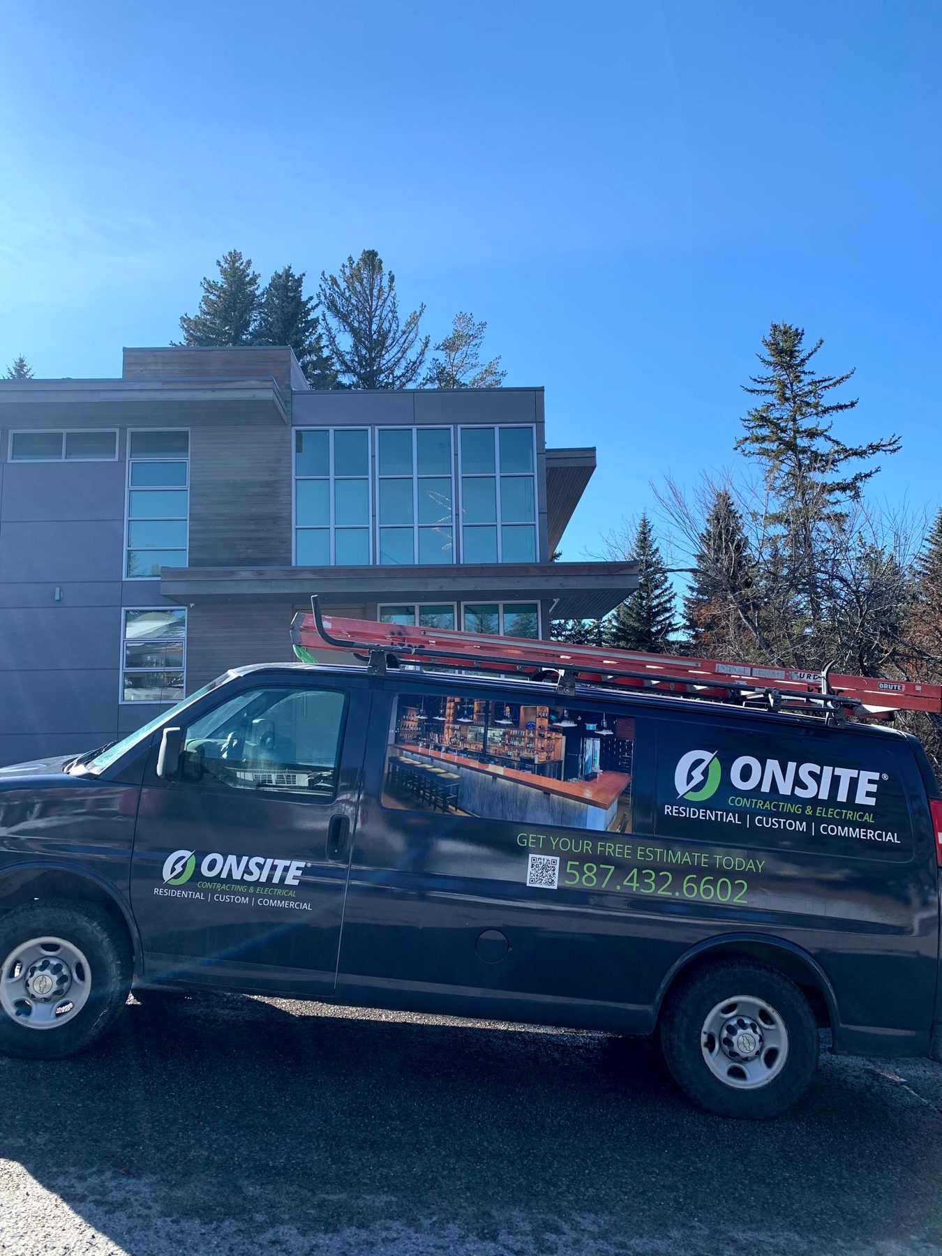 Modern house exterior with electrical van and ladder on roof — Pump Hill