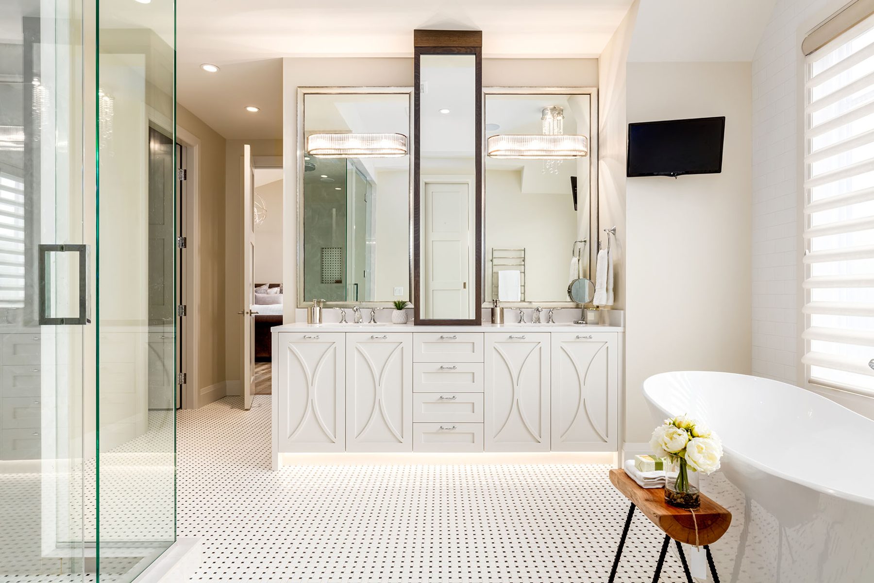 Bright modern bathroom with white vanity, dual sinks, and freestanding tub — Artista