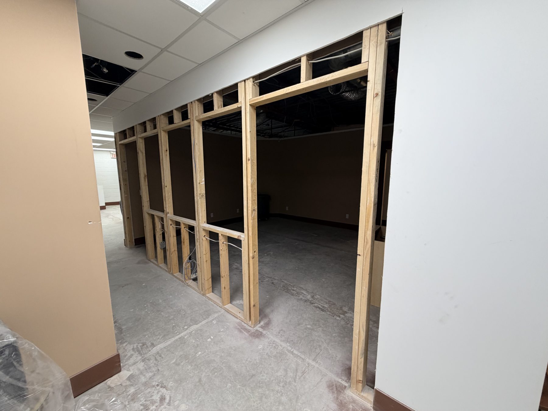 Interior framing and concrete floor in unfinished office space — The Barron Venue