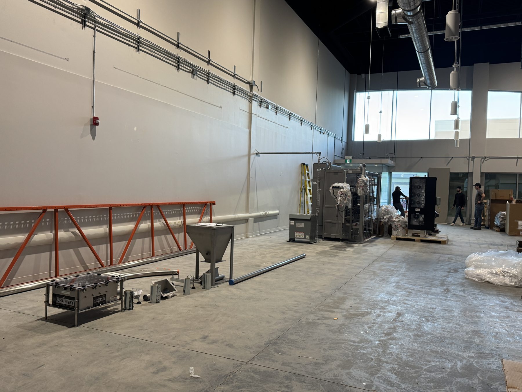Industrial equipment and piping installed in unfinished room — Eight Ounce Coffee by Onsite Contracting Services