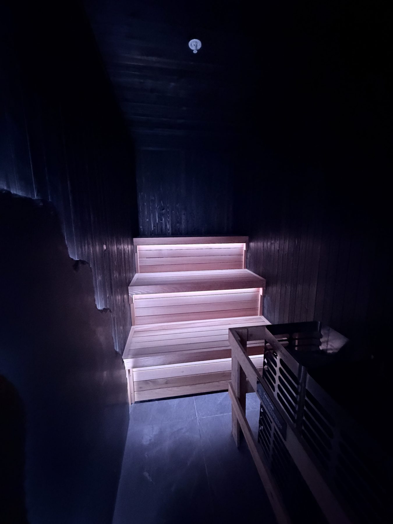 Wooden sauna benches with integrated lighting and a heater — Cedar Steam and Spa (Trinity Hills)