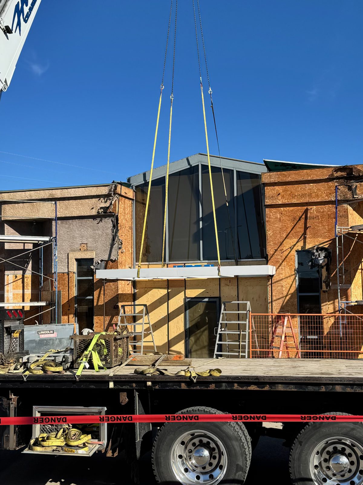 Crane lifts new building facade onto construction site — Blowers and Grafton (Red Deer)