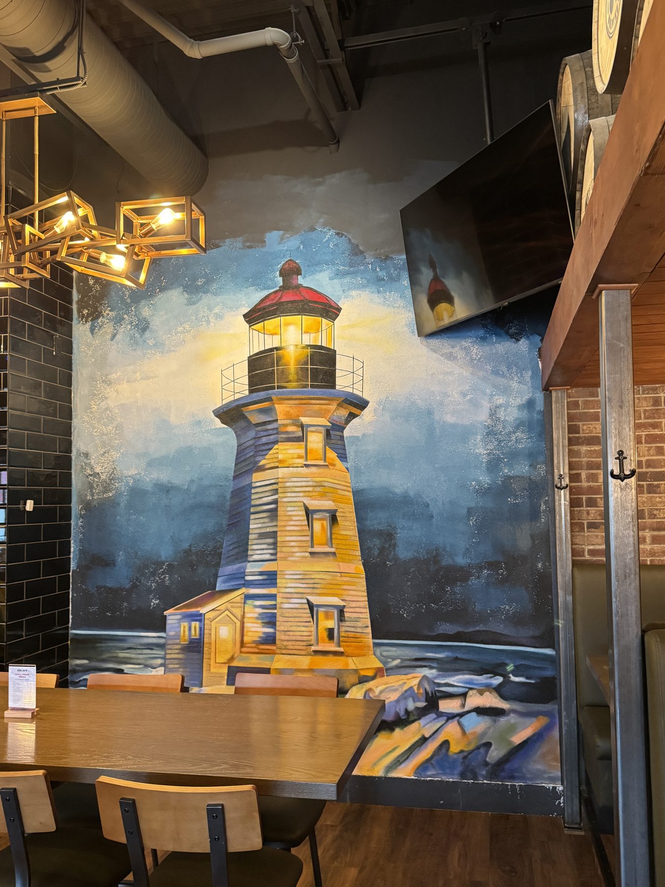 Restaurant dining area with lighthouse mural and new furniture — Blowers and Grafton (Lloydminster)