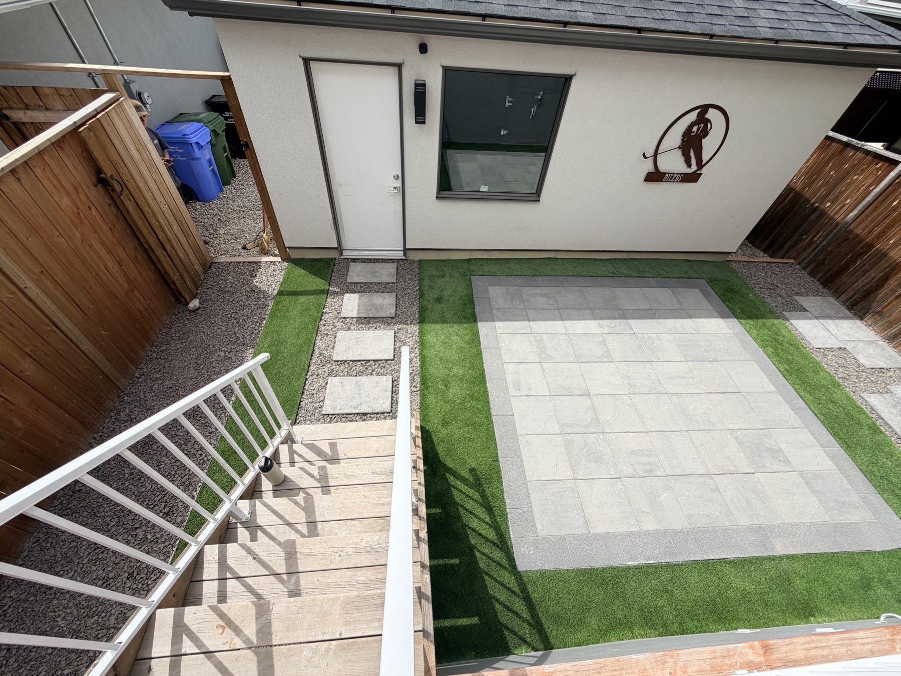 Backyard patio with paver and artificial turf installation underway — 3505 41 Street SW, Calgary