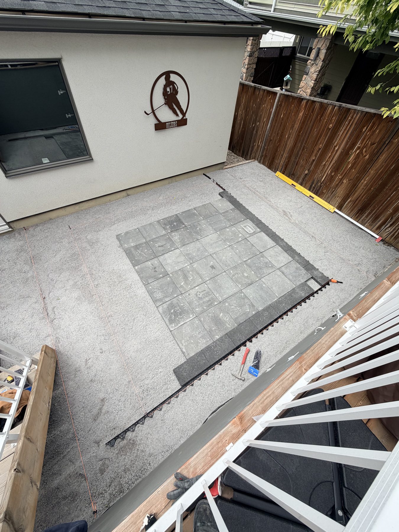 Backyard patio under construction with gravel and pavers laid — 3505 41 Street SW, Calgary