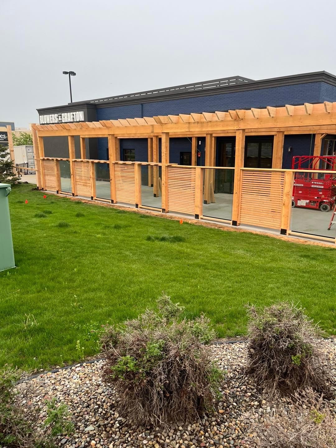 Wooden pergola and glass fence installation for outdoor dining area — Blowers and Grafton (Lethbridge)