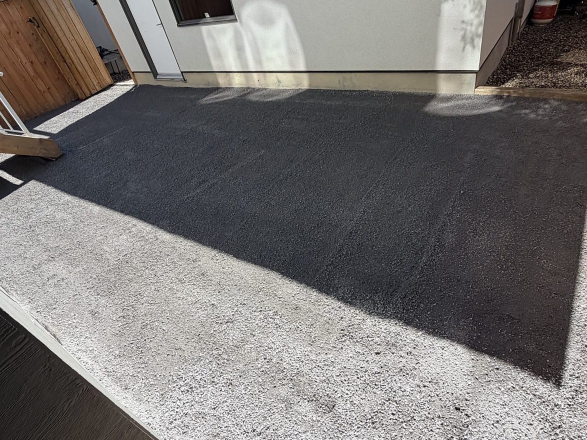 Dark asphalt paving laid over a gravel base next to a building — 3505 41 Street SW, Calgary
