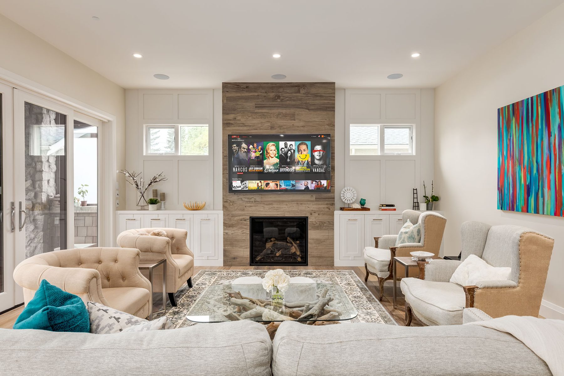 Living room with fireplace, TV, and neutral-toned furniture completed — Artista