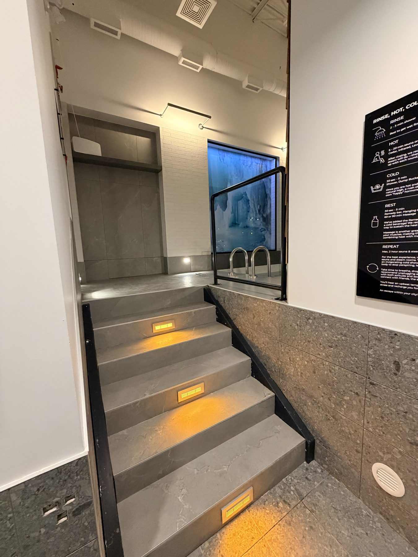 Modern spa renovation with illuminated stairs and glass enclosure — Cedar Steam and Spa (Trinity Hills)