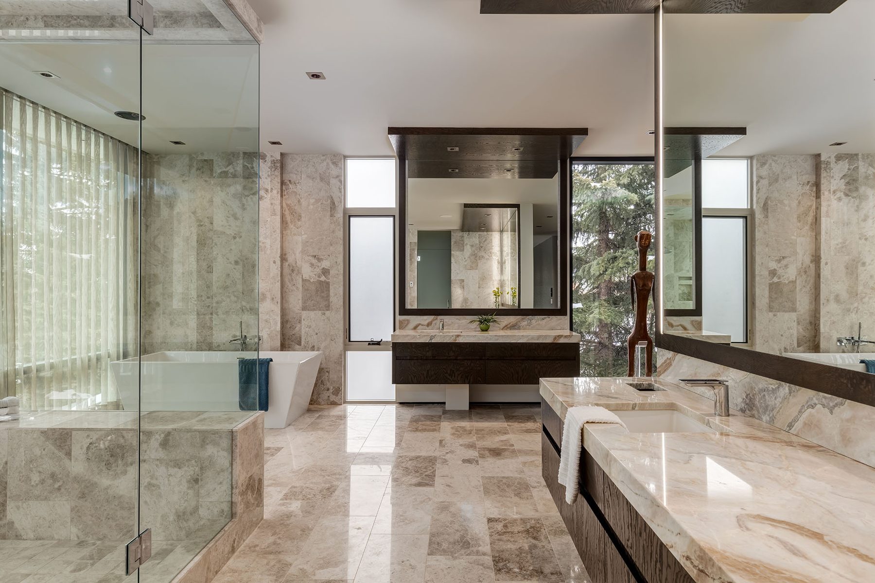 Luxury marble bathroom with freestanding tub and dual vanity — Modern Family