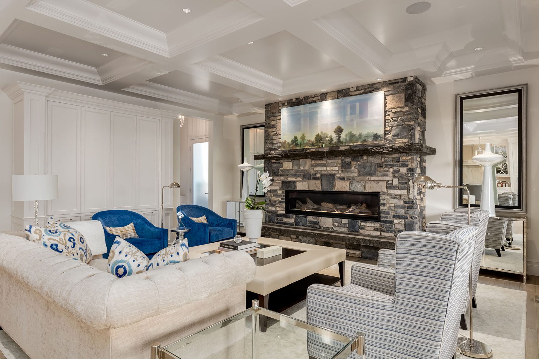 Living room with stone fireplace, coffered ceiling, and built-in cabinets — White House