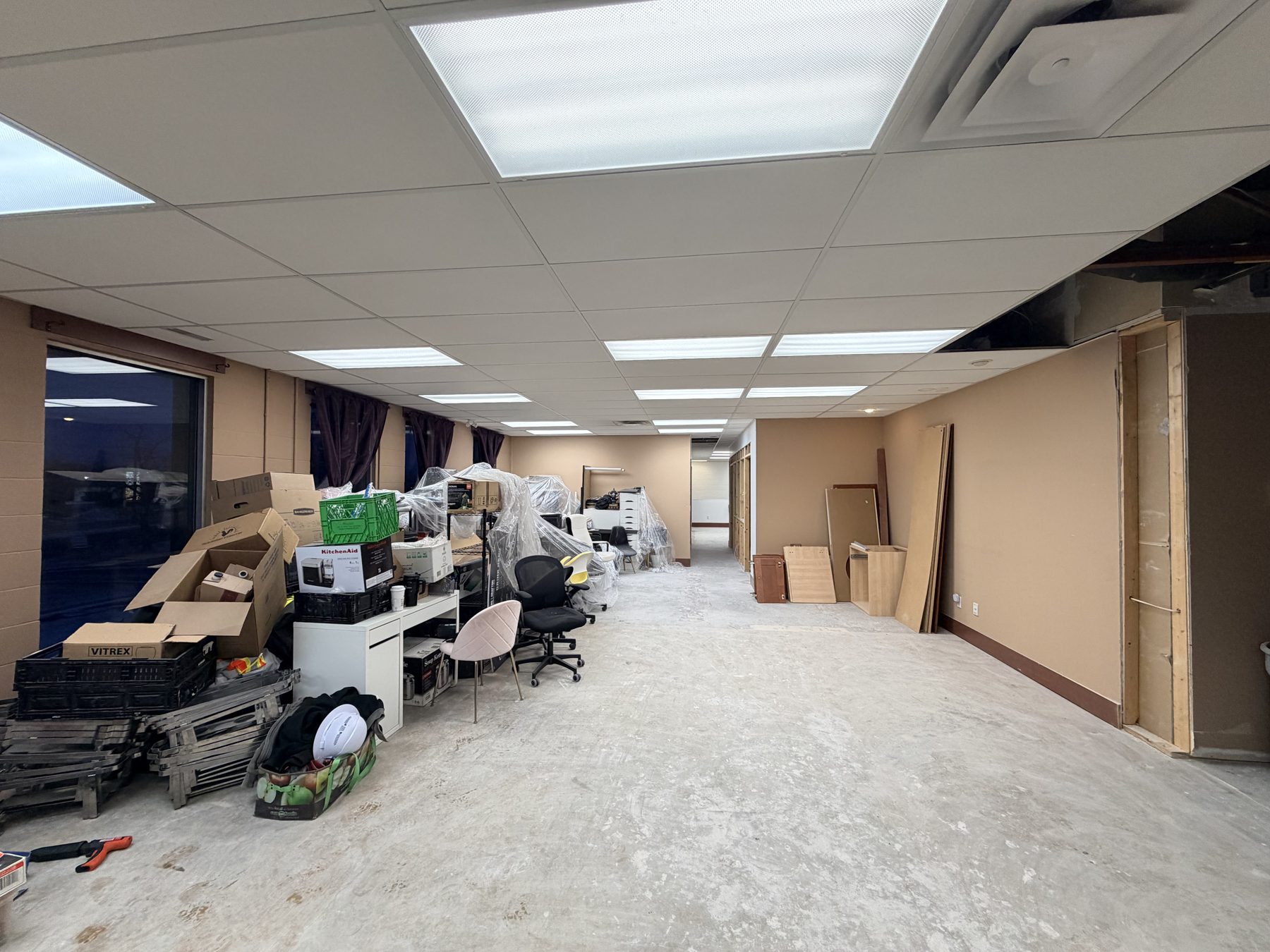 Construction site with boxes, chairs, and unfinished walls — The Barron Venue