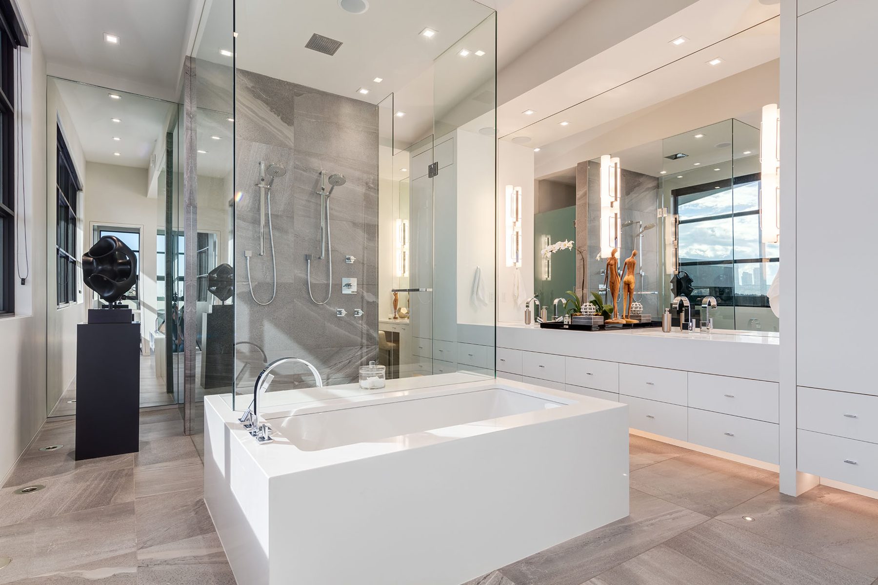 Modern bathroom features soaking tub, glass shower, and dual vanity — Infinity