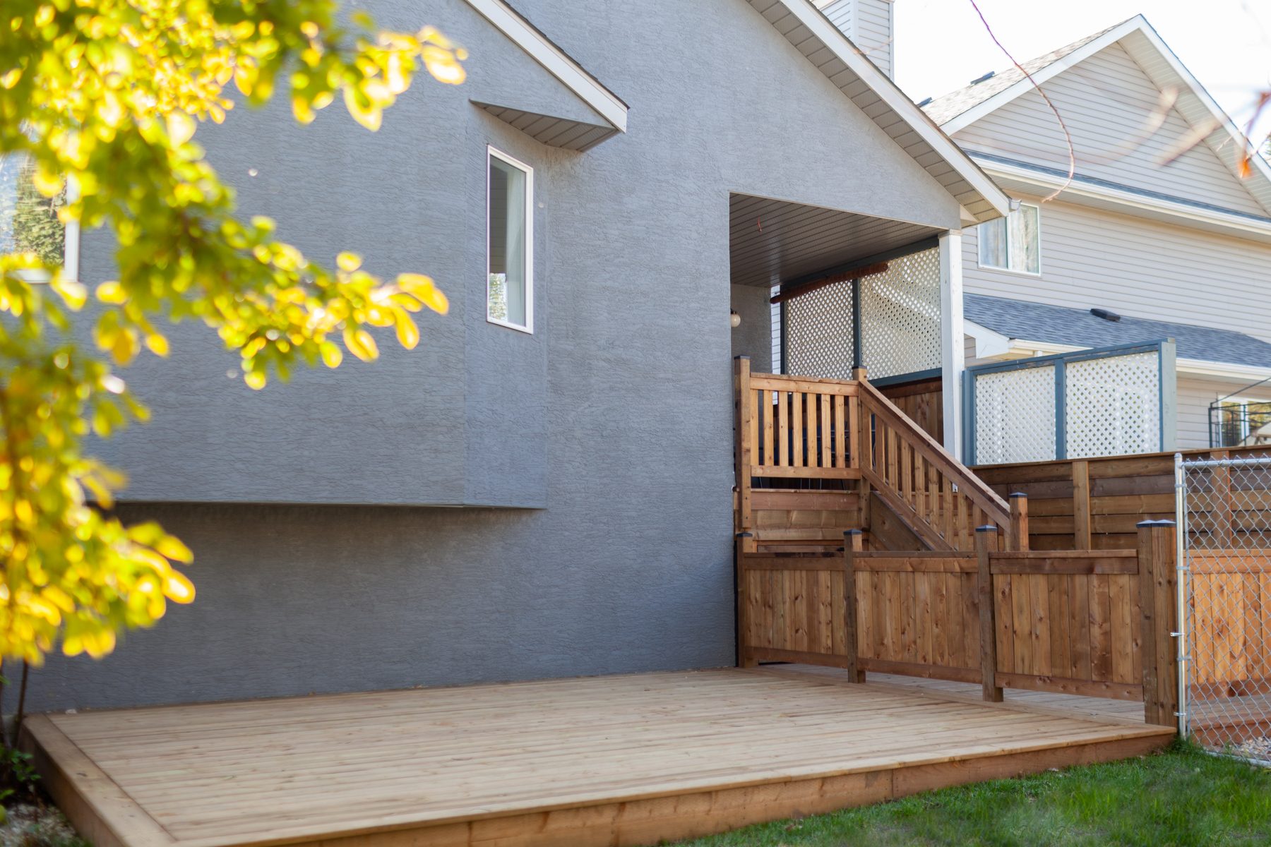 Newly built wooden deck and stairs with lattice privacy screens — 32 Somercrest Manor SW by Onsite Contracting Services