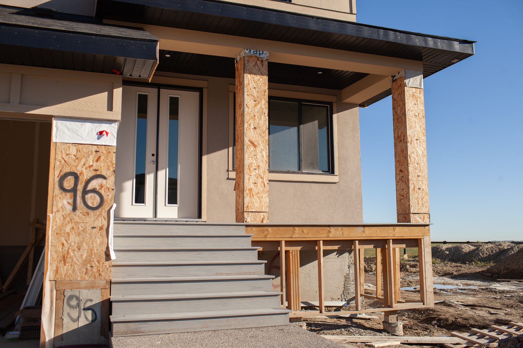 Exterior porch under construction with unfinished framing and siding — 96 Fieldstone Close by Onsite Contracting Services