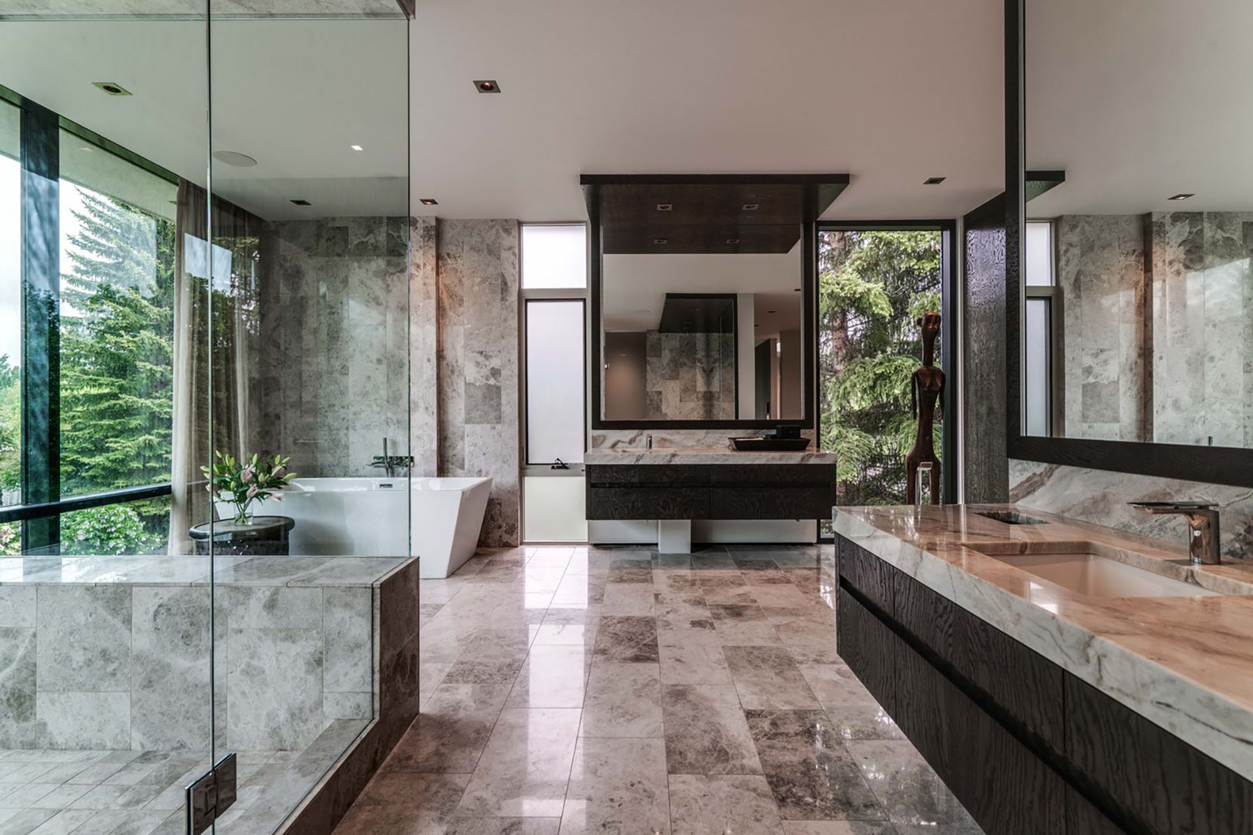Modern marble bathroom with freestanding tub and double vanity — Modern Family