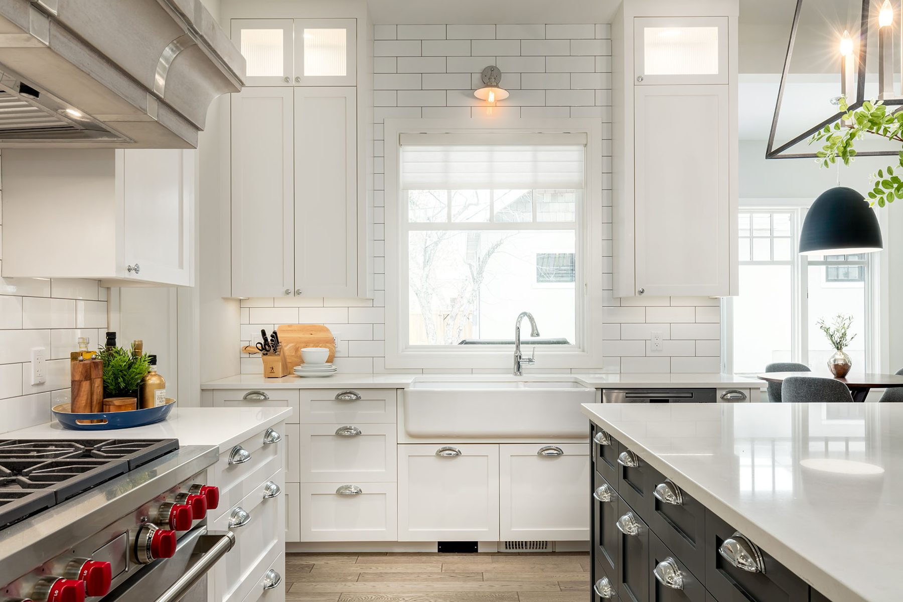 Modern kitchen with white subway tile and farmhouse sink, mostly complete — Cleret Velour