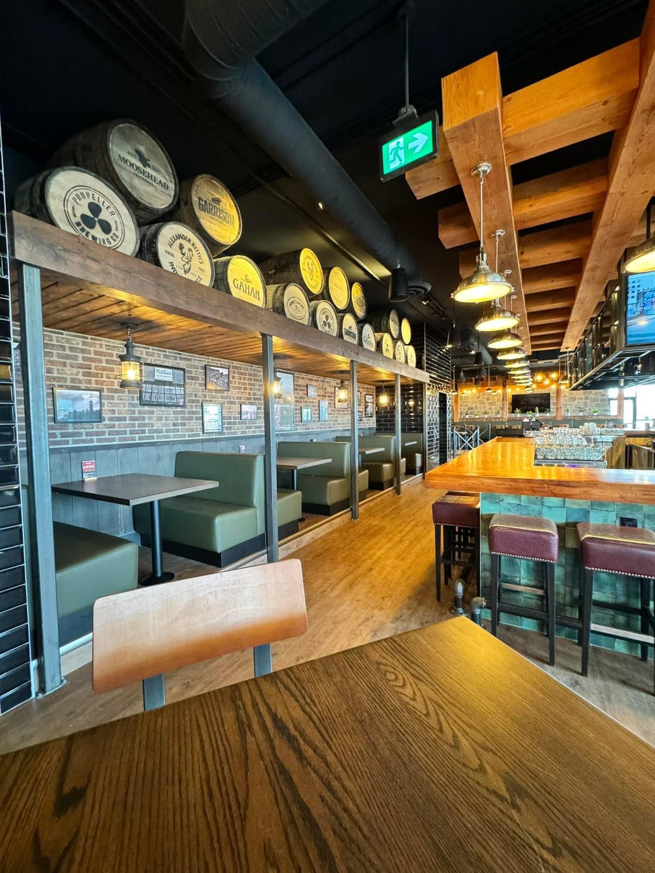 Restaurant interior with booths, bar, and decorative beer barrels — Blowers and Grafton (Shawnessy)