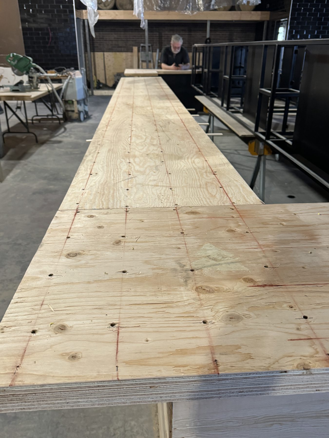 Plywood countertop framework with red markings and screw holes — Blowers and Grafton (Medicine Hat)