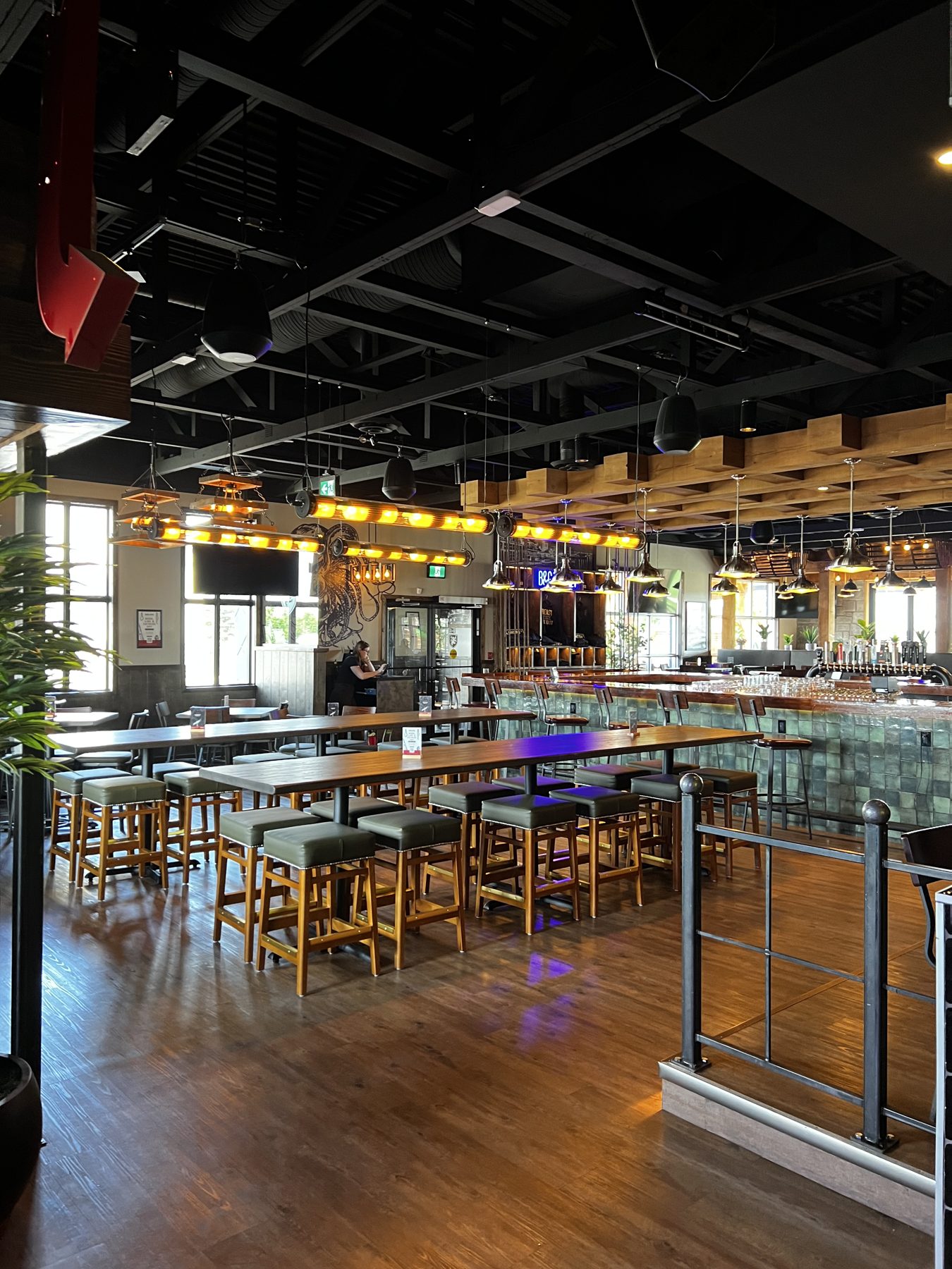 Restaurant dining area with tables, stools, and a bar — Blowers and Grafton (Lethbridge)