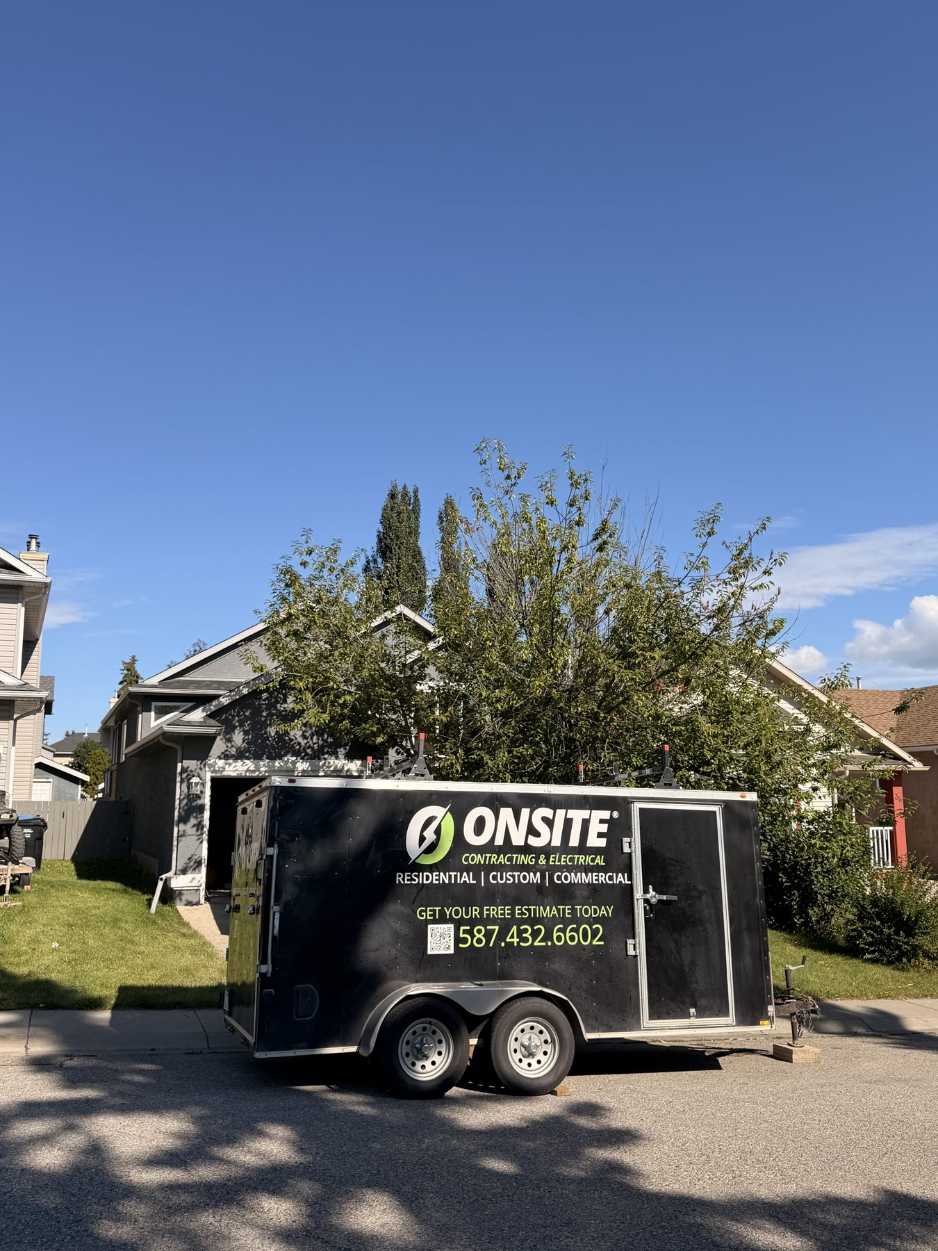 House undergoing renovation with contractor trailer parked in driveway — 32 Somercrest Manor SW