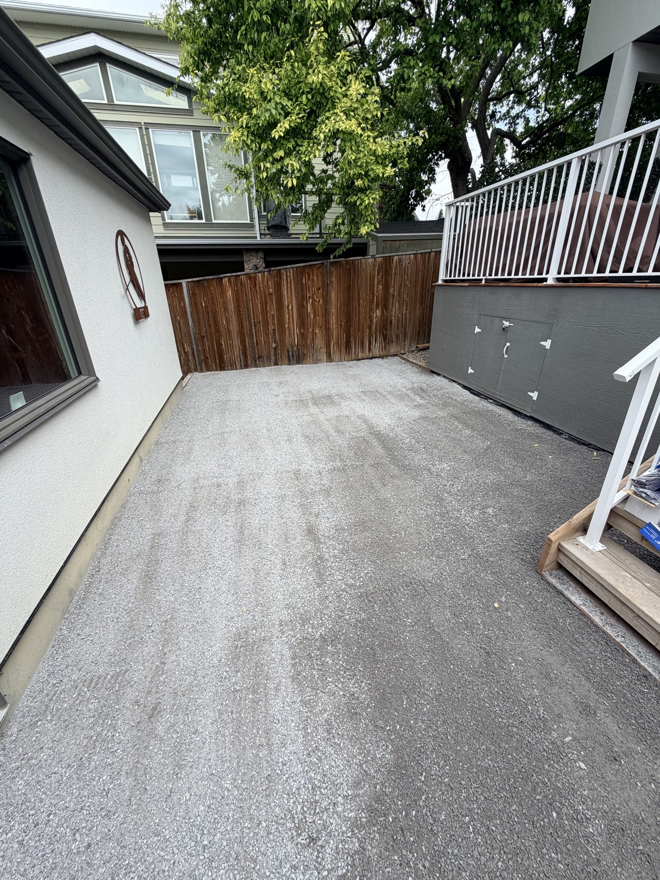Gravel driveway installation with new deck and storage unit — 3505 41 Street SW, Calgary