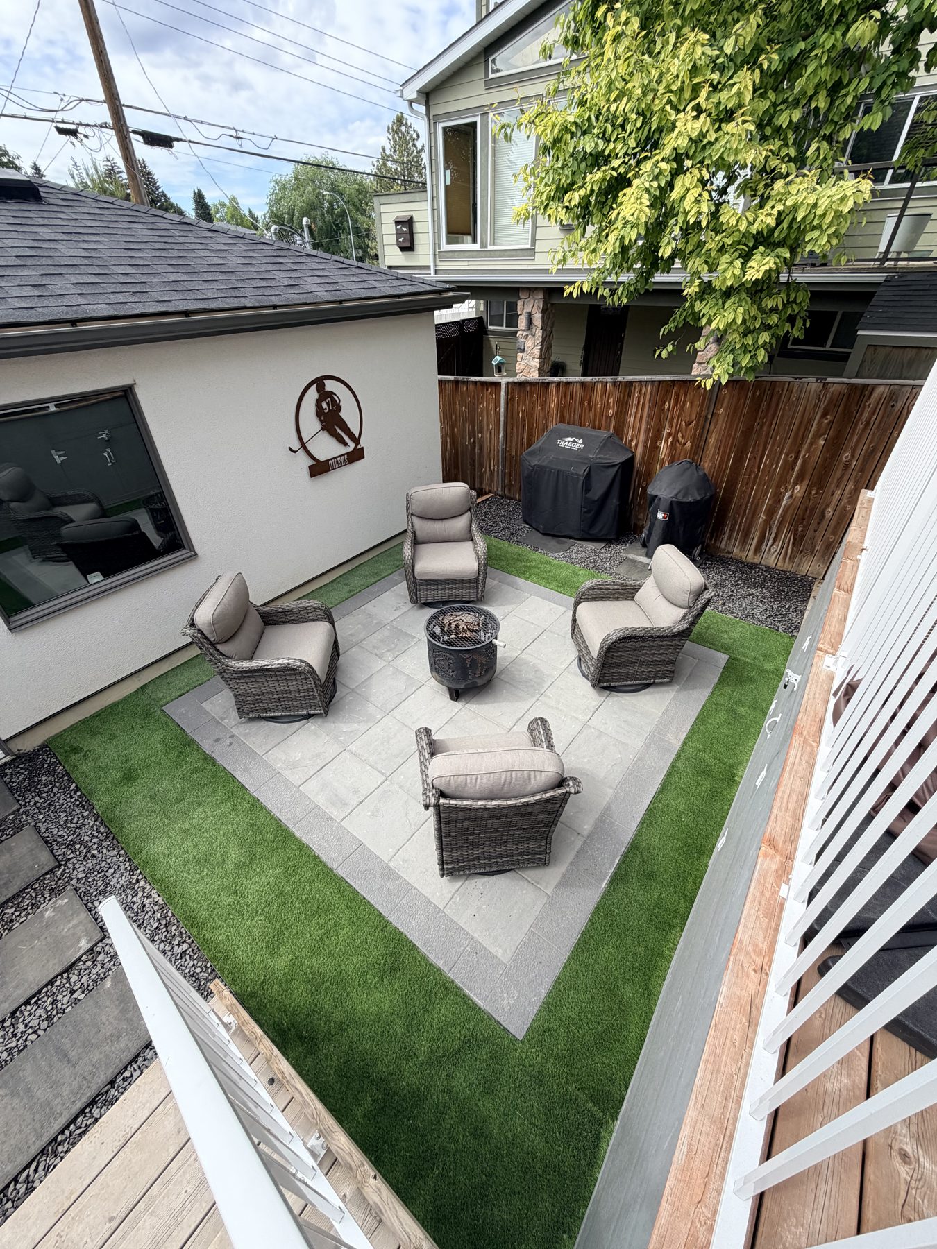 Patio with turf, chairs, fire pit, and grills completed — 3505 41 Street SW, Calgary
