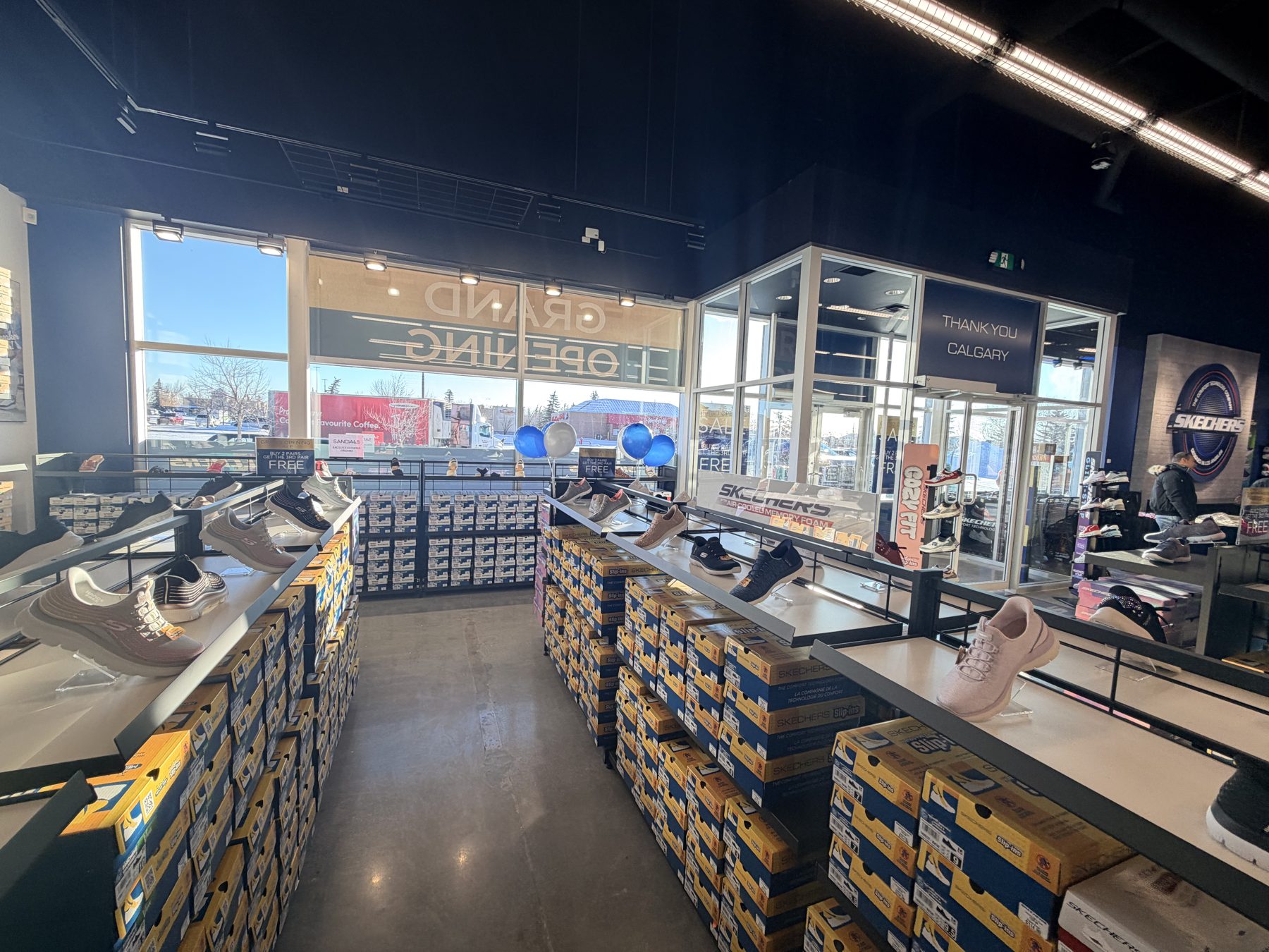 Shoe store interior, with shoe displays and boxes — Skechers (Signal Hill)