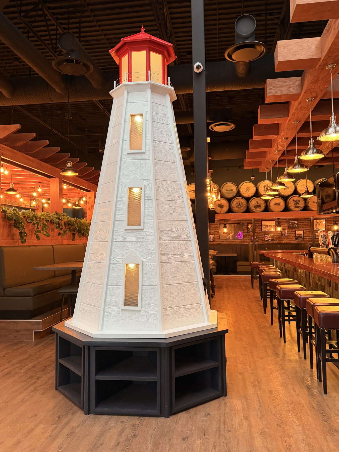 Restaurant interior with decorative lighthouse, bar, and seating — Blowers and Grafton (Red Deer)