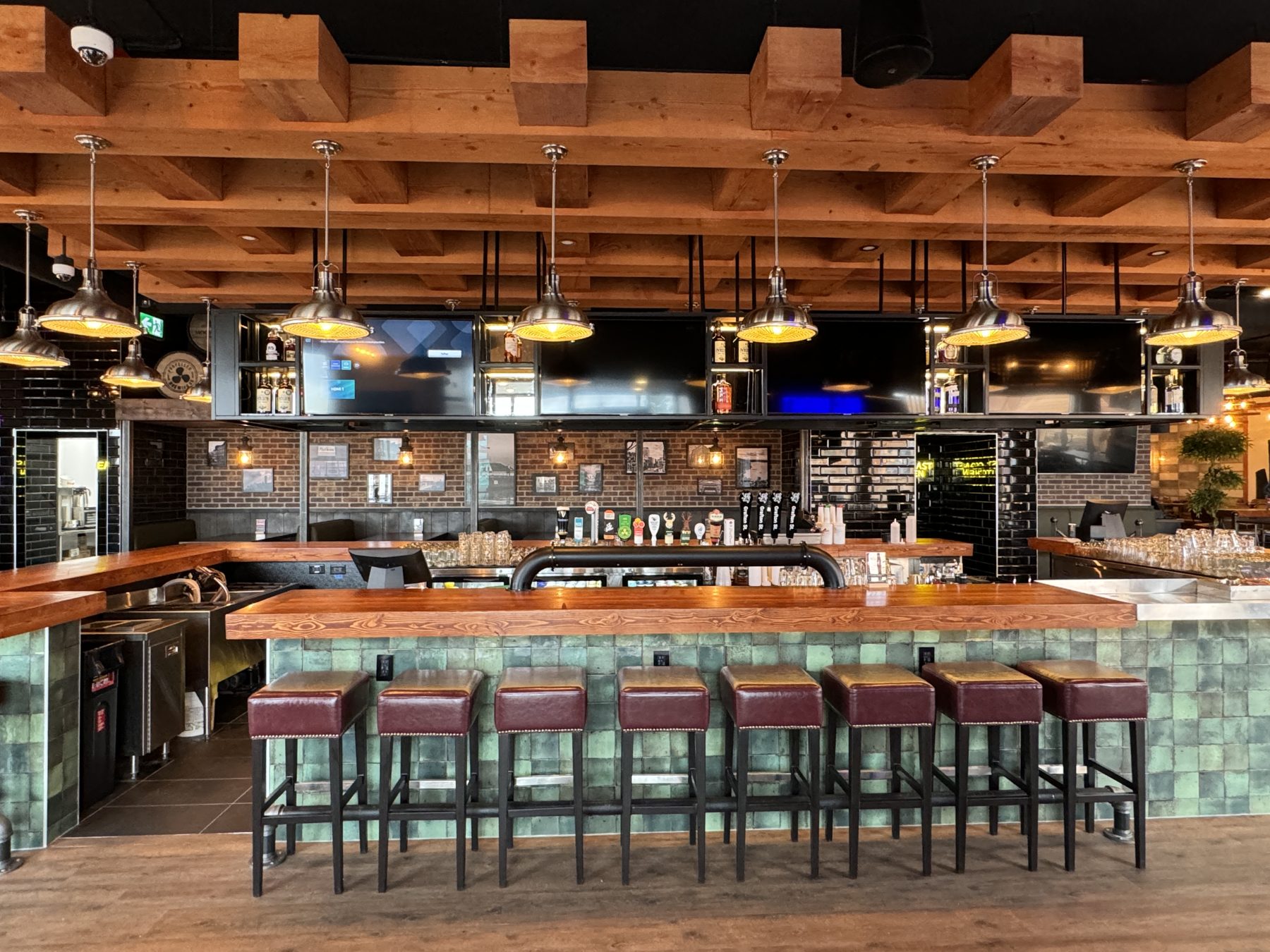 Bar stools and counter with wooden and tiled accents, construction ongoing — Blowers and Grafton (Shawnessy)