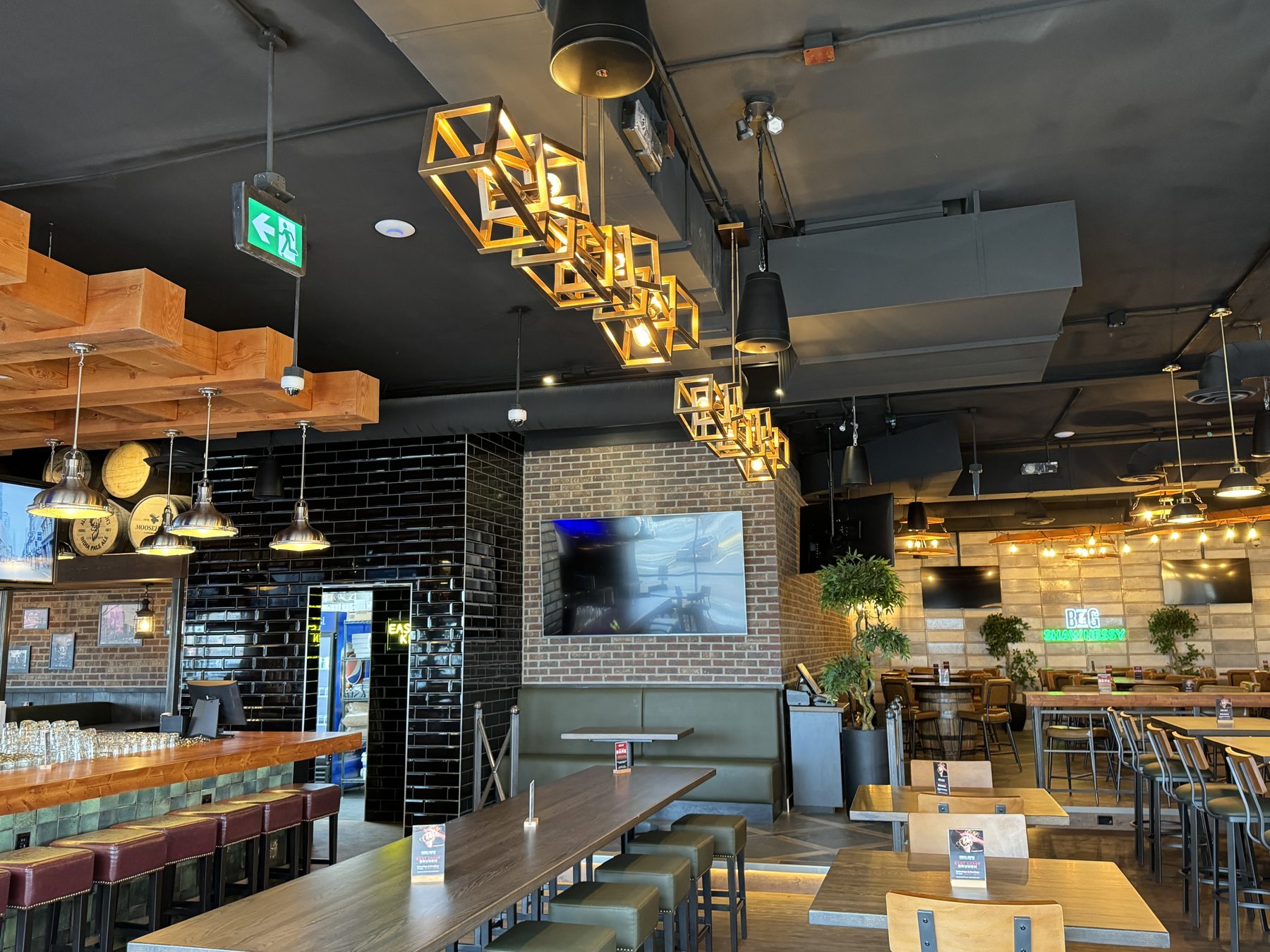 Restaurant interior with bar, tables, and modern geometric lighting — Blowers and Grafton (Shawnessy)