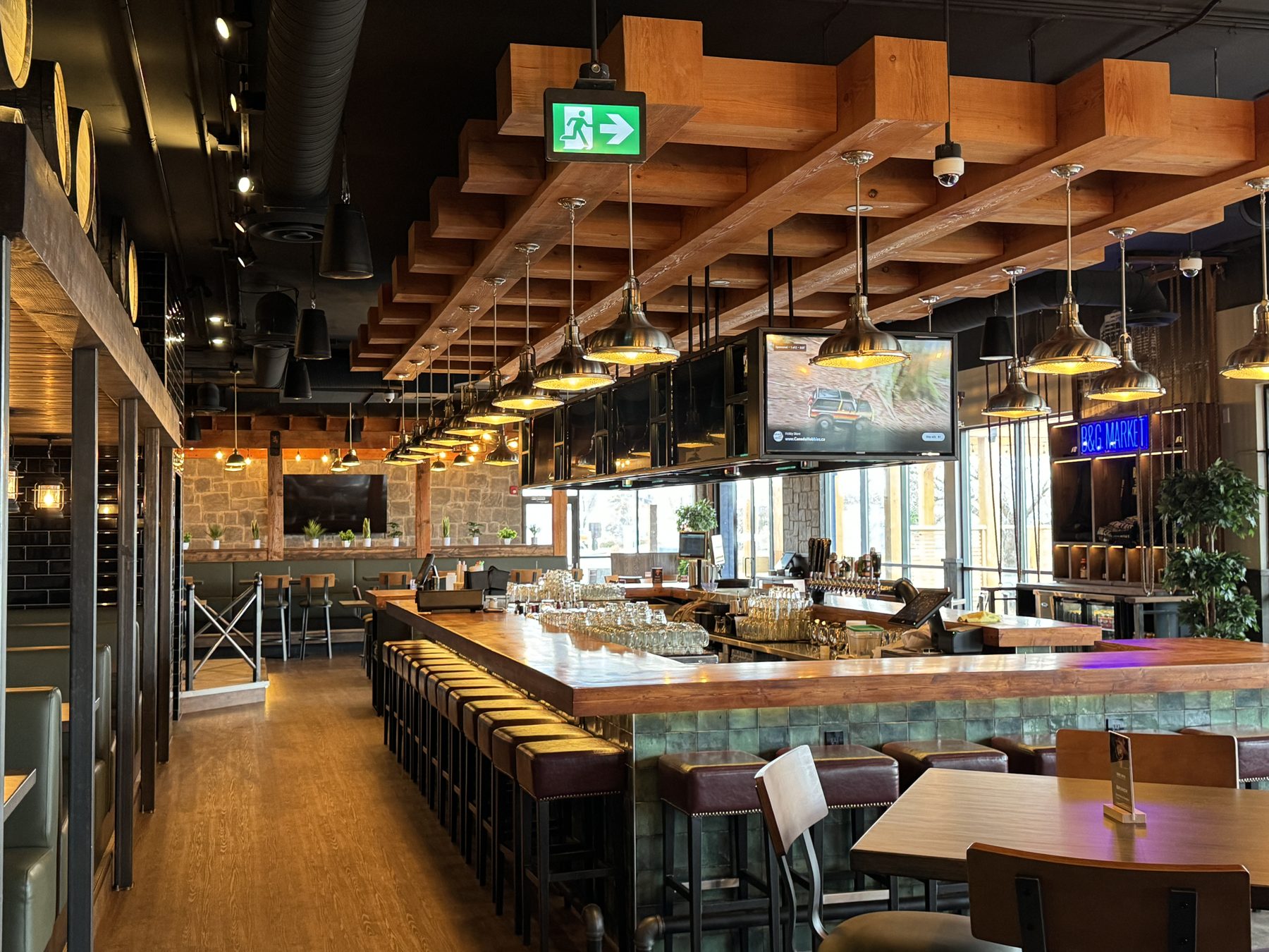 Modern bar renovation with wood beams, TVs, and bar stools — Blowers and Grafton (Shawnessy)