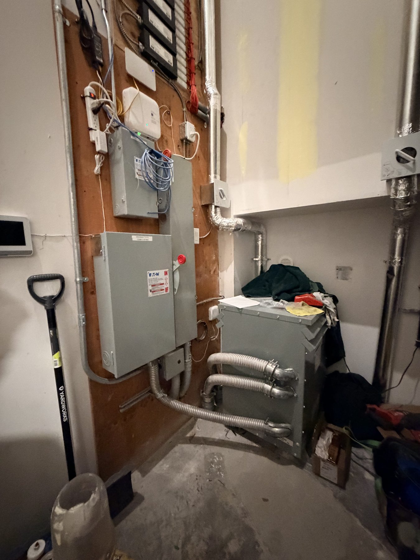 Electrical panels, ductwork, and a shovel in a room — Cedar Steam and Spa (Trinity Hills)