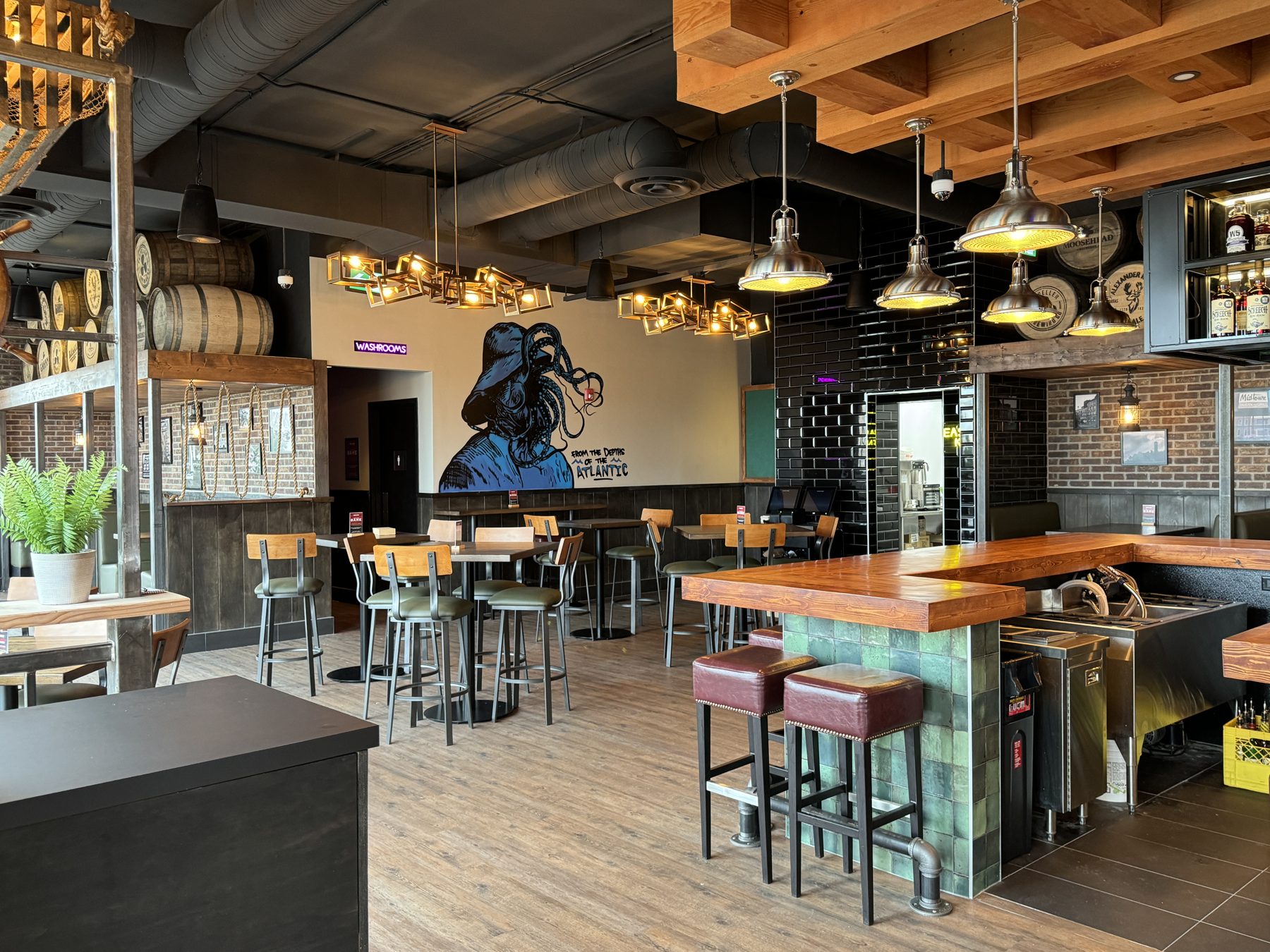 Restaurant interior with wood bar, industrial lighting, and unique wall art — Blowers and Grafton (Shawnessy)
