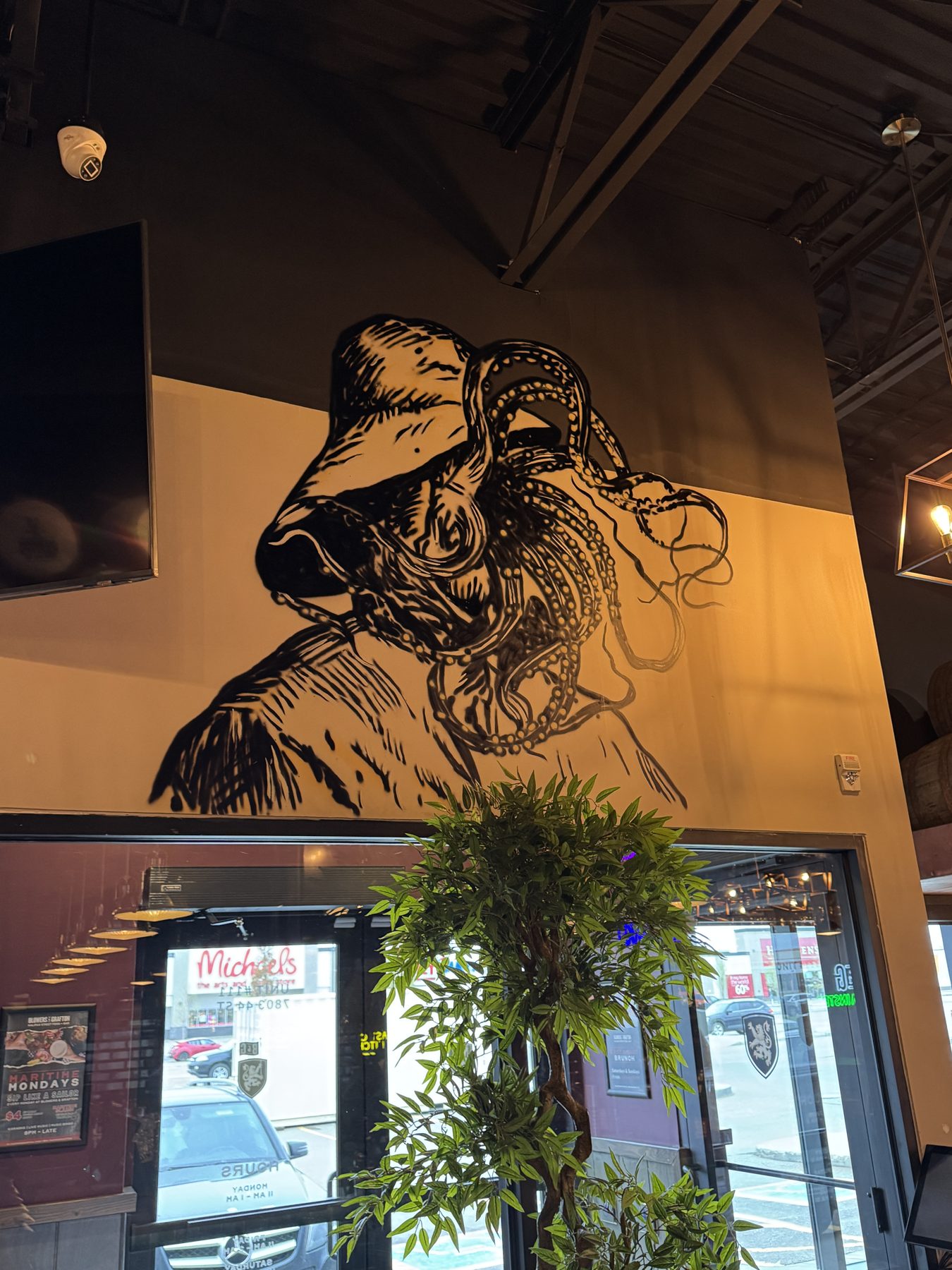 Wall mural of octopus tentacles on white and gray wall — Blowers and Grafton (Lloydminster)