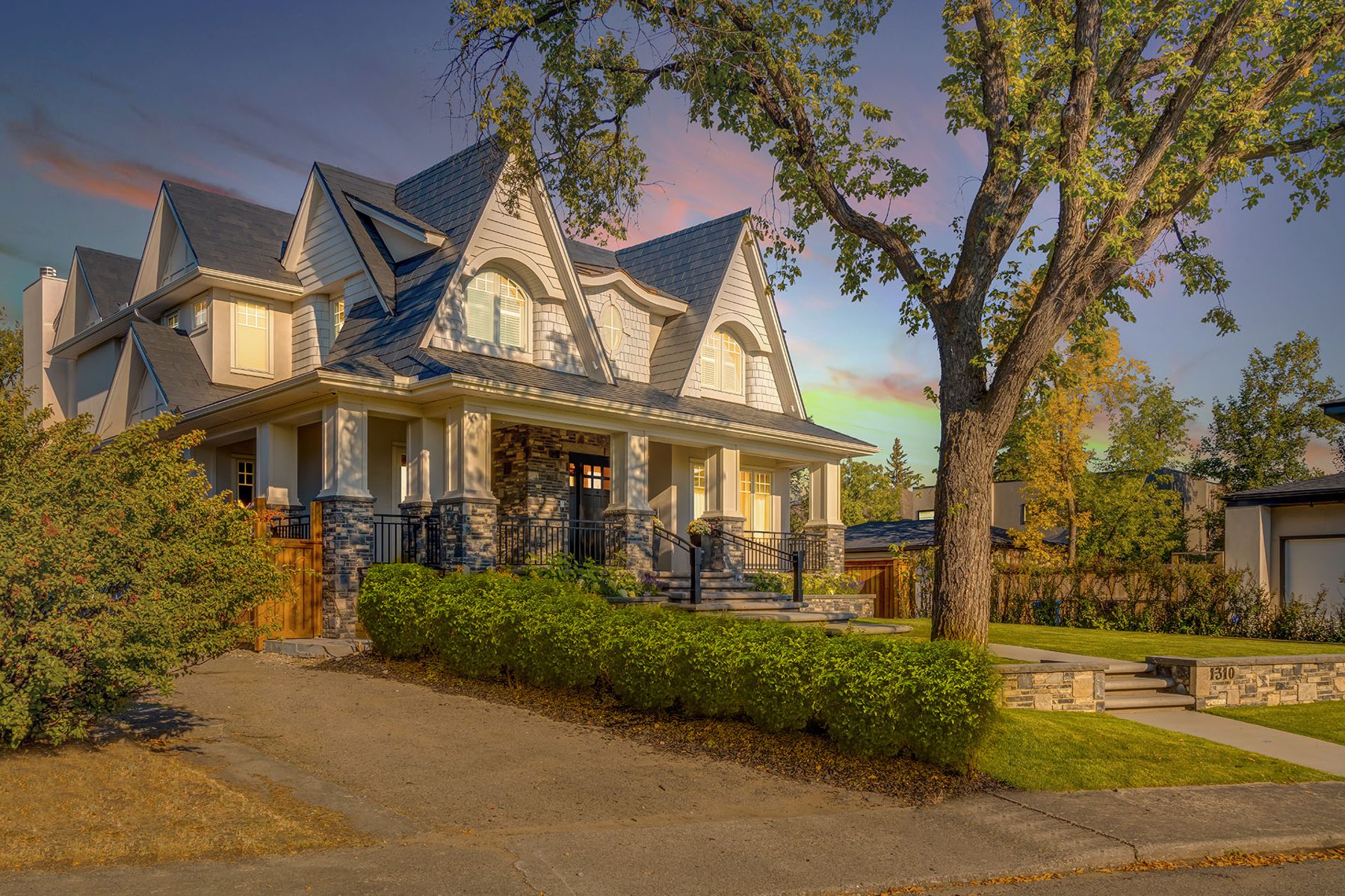 Large house with stone accents and multiple dormers, new construction — White House