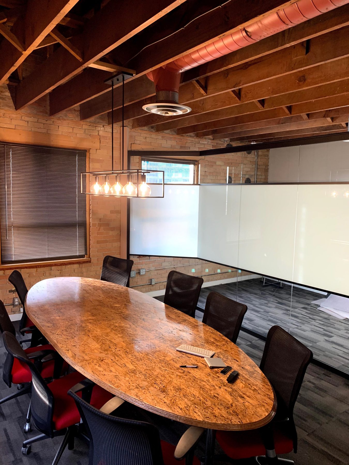 Modern conference room with exposed wood beams and glass partitions — Clearmotive (Victoria Park)