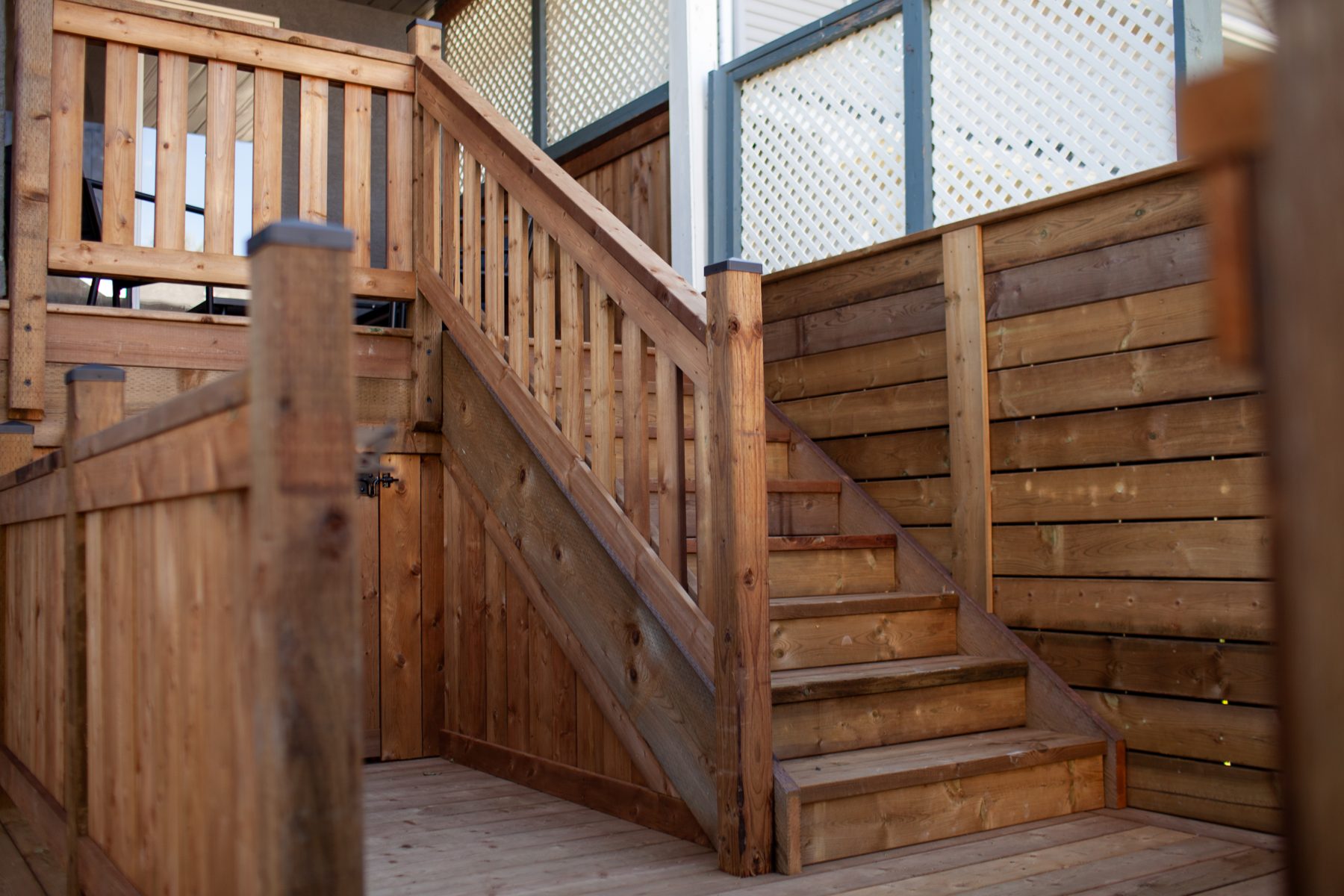 Wooden deck stairs and railing, under construction — 32 Somercrest Manor SW