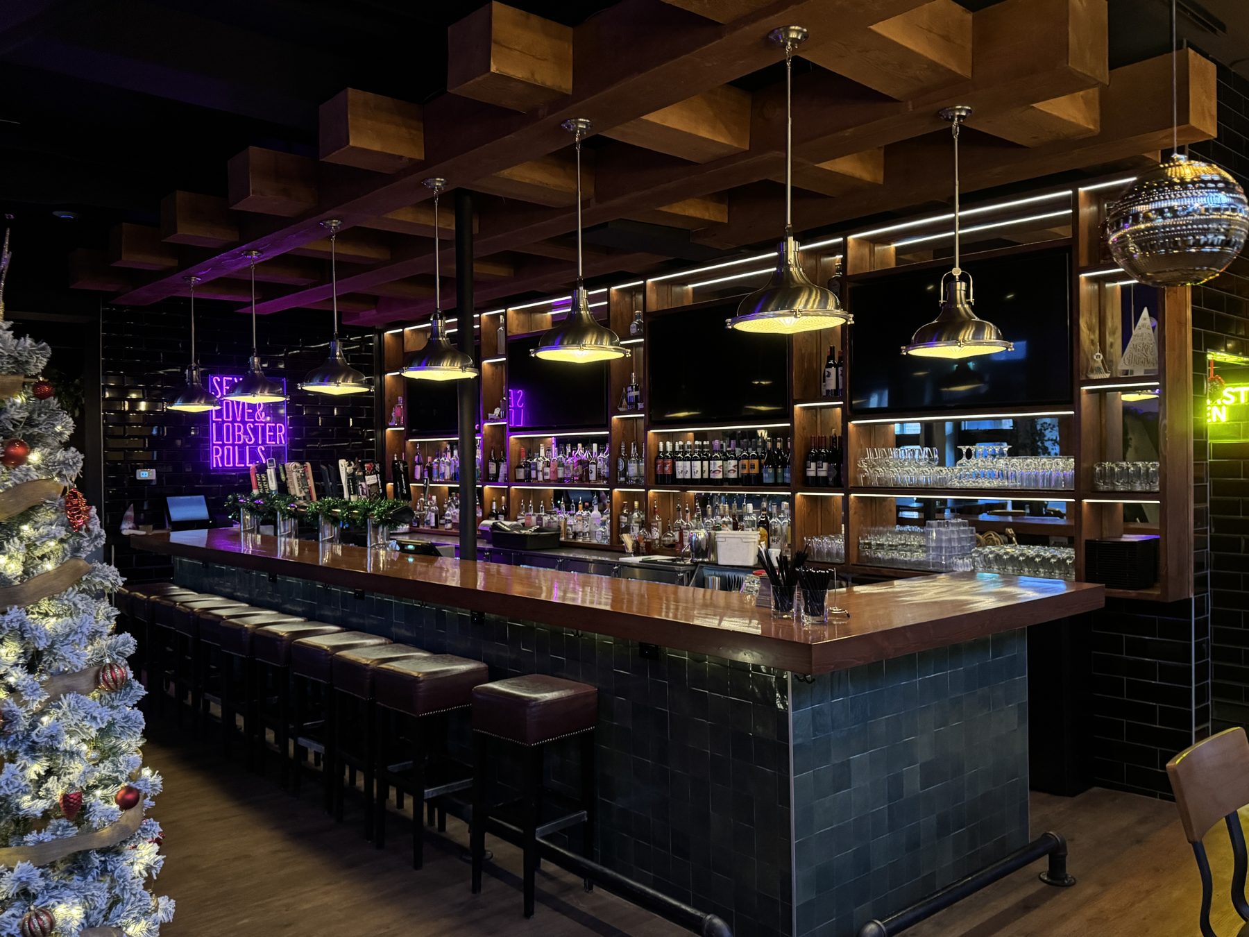 Bar with wooden beams, pendant lights, and stocked shelves — Blowers and Grafton (Mission)