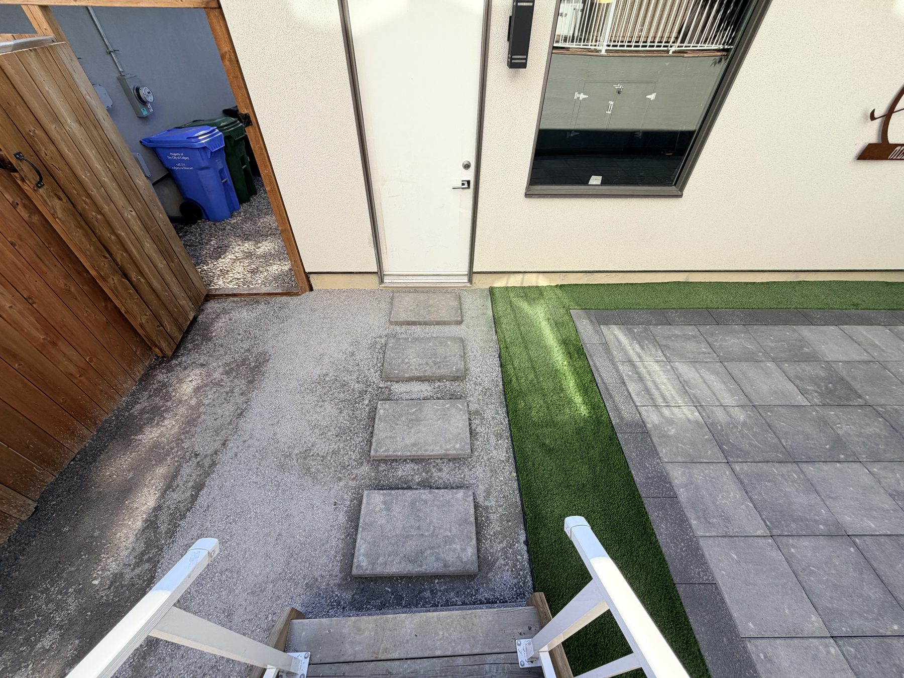 Backyard patio, artificial turf, stepping stones, and new fencing — 3505 41 Street SW, Calgary