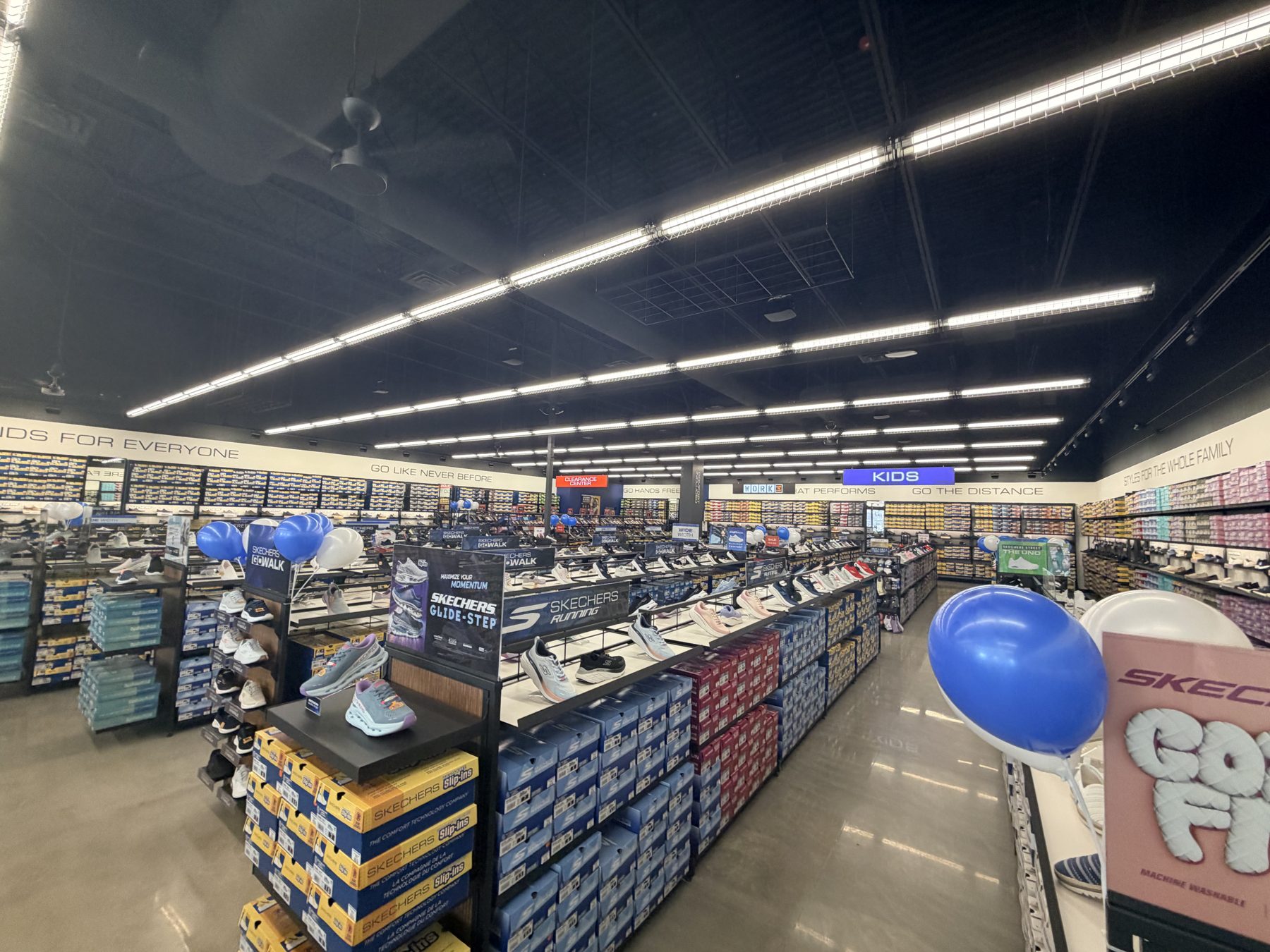 Shoe store renovation with shoes, boxes, and balloons on display — Skechers (Signal Hill)